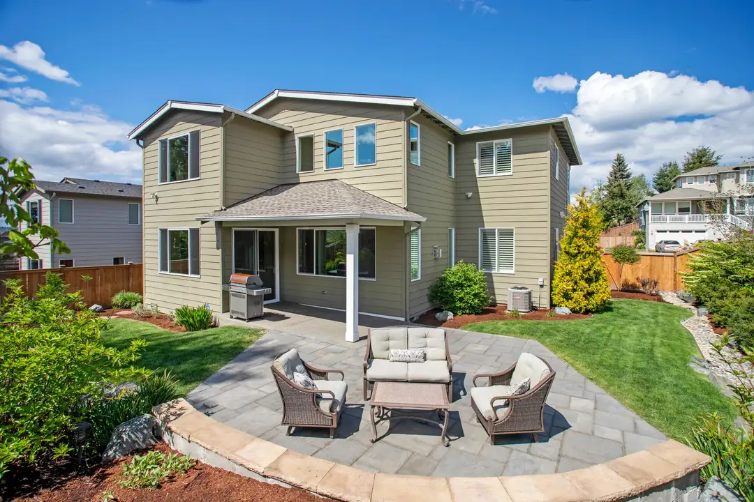 Paver patio behind a house
